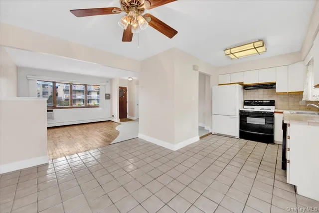 a view of a kitchen with microwave and cabinets