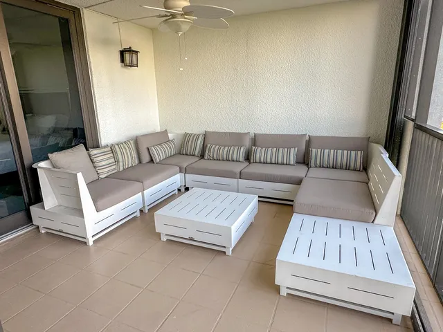 a view of a balcony with chairs