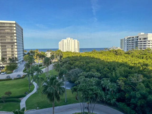 a view of a lake with a city skyline in the background