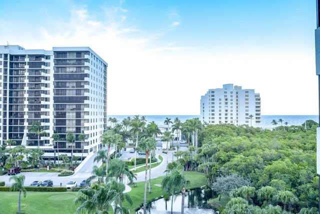 a front view of a building with a yard