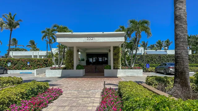 a view of swimming pool with a table and chairs
