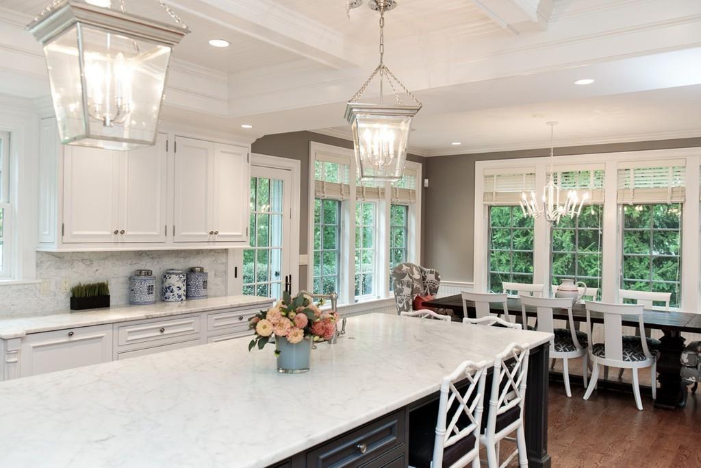71 Hundreds Road Wellesley, MA 02481 - Photo 15 of 31 a view of a dining room and livingroom with furniture wooden floor a chandelier