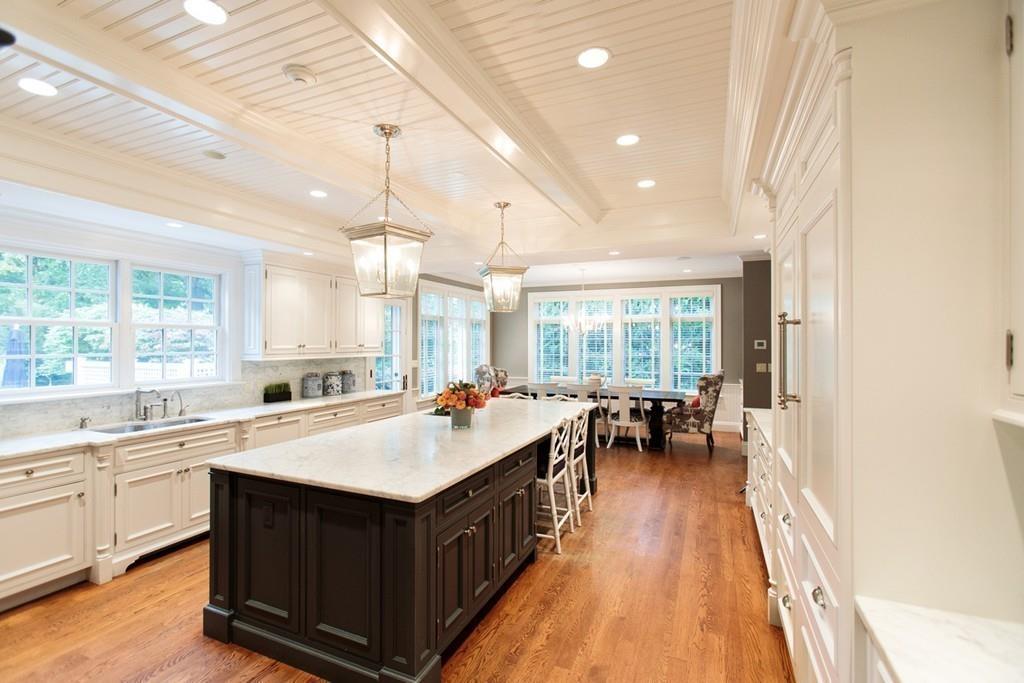 71 Hundreds Road Wellesley, MA 02481 - Photo 17 of 31 a kitchen with a sink and wooden cabinets