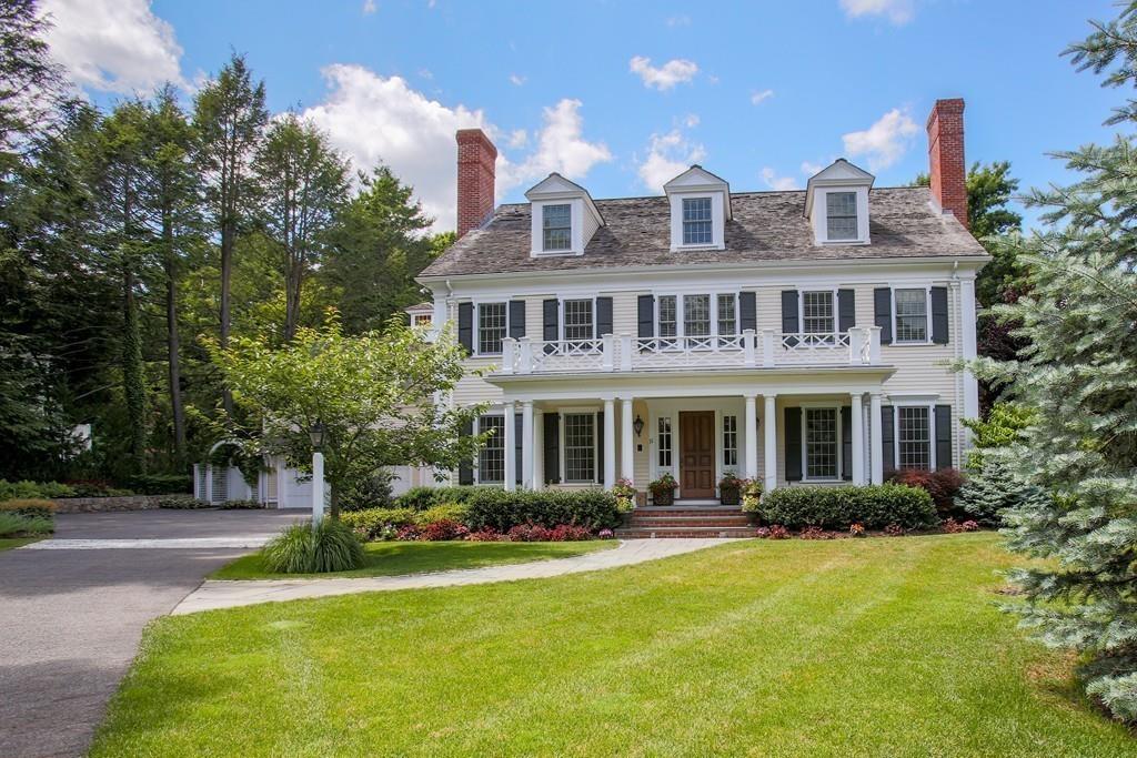 71 Hundreds Road Wellesley, MA 02481 - Photo 3 of 31 a front view of a house with swimming pool and porch