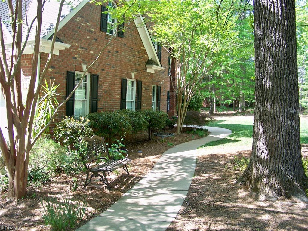 5805 Autumn Gate Drive Oak Ridge, NC 27310 - Photo 2 of 30 What an inviting path for guests!