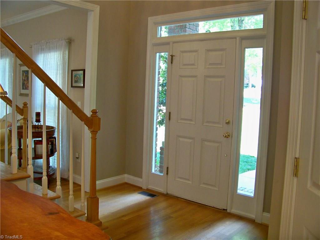 5805 Autumn Gate Drive Oak Ridge, NC 27310 - Photo 11 of 30 This house is all about LIGHT! From the front door to the back, sidelights, transoms, and banks of windows! Not shown is a door to the left of front door that goes to the main level bedroom/study.