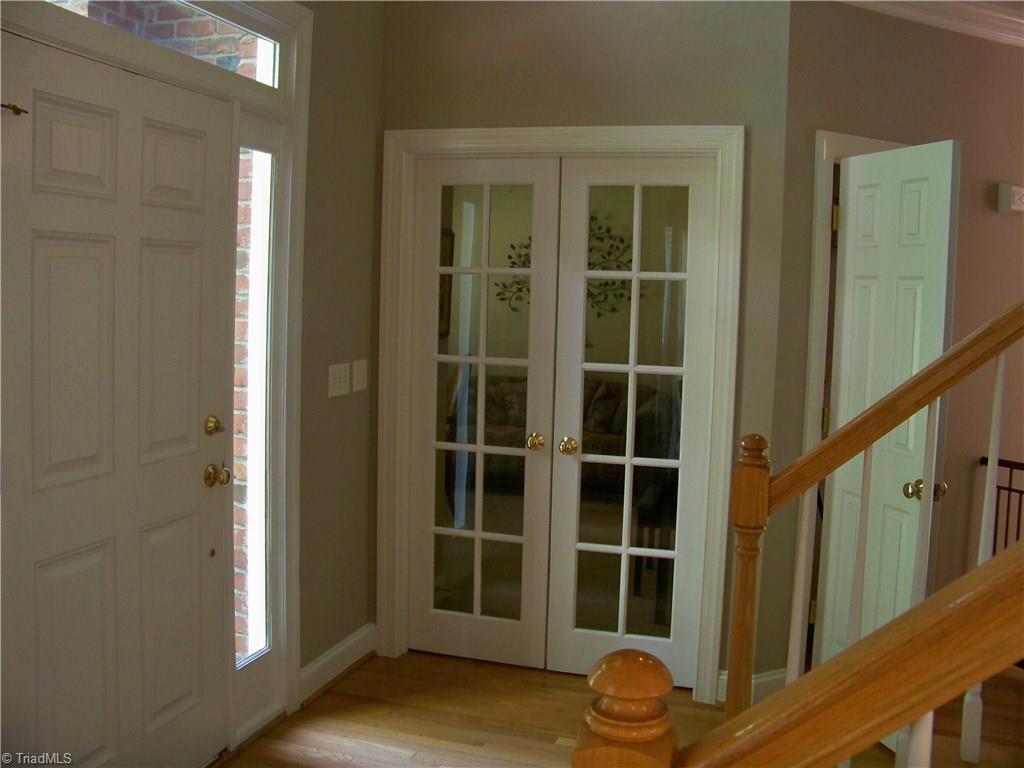5805 Autumn Gate Drive Oak Ridge, NC 27310 - Photo 13 of 30 Doors to downstairs bedroom/library/office. Room also adjoins full bath w/bathtub.