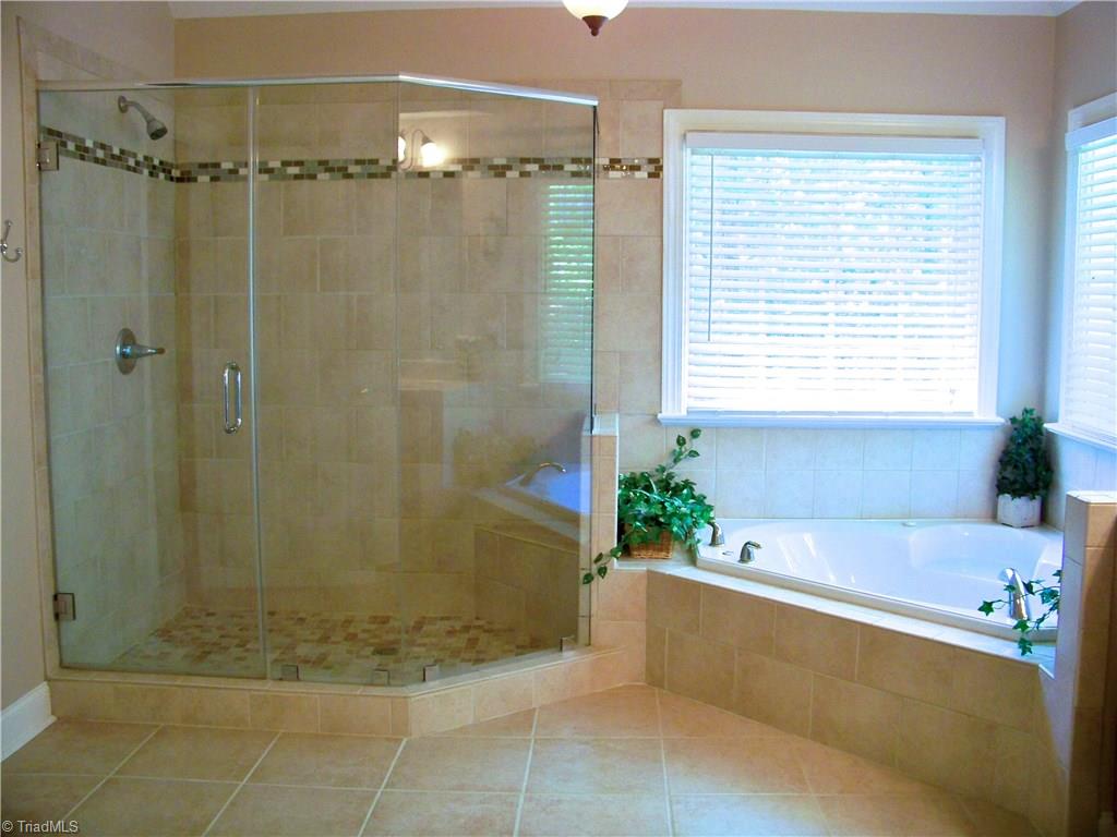 5805 Autumn Gate Drive Oak Ridge, NC 27310 - Photo 20 of 30 Nice remodel of this HUGE master bath with custom tile and a new shower surround!