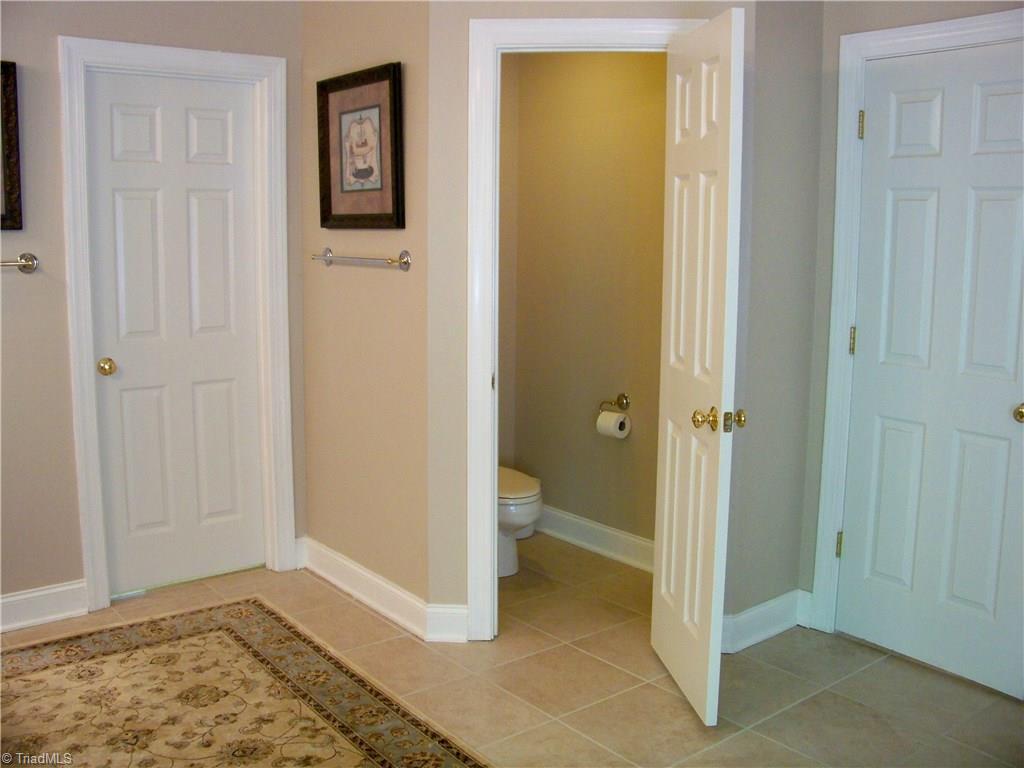 5805 Autumn Gate Drive Oak Ridge, NC 27310 - Photo 21 of 30 This pic just underlines how large the master bath is. Separate commode area is a plus! Through door to the left is the HUGE master closet, weighing in just under 12x12, it has 2 separate areas for you and yours!