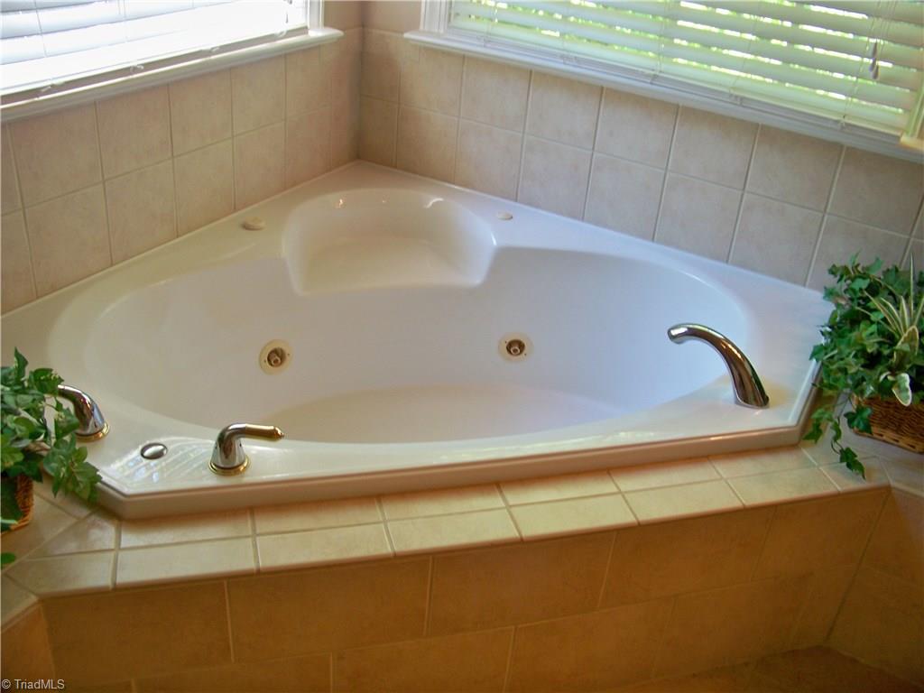 5805 Autumn Gate Drive Oak Ridge, NC 27310 - Photo 22 of 30 Soak your tired bones after a workout or warm up during those cold winter months!