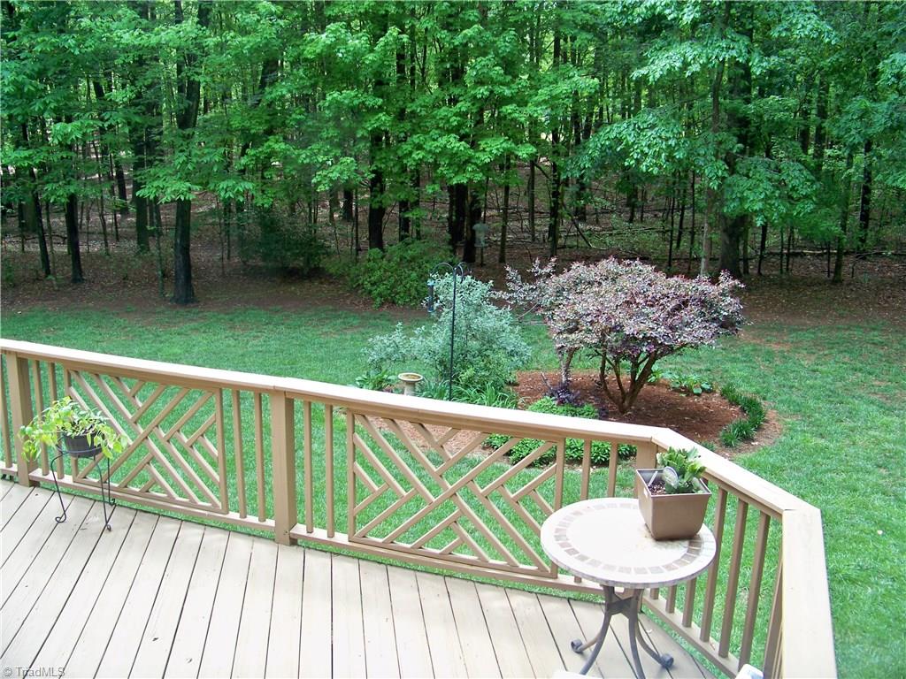 5805 Autumn Gate Drive Oak Ridge, NC 27310 - Photo 29 of 30 A gorgeous yard that incorporates open space with nice landscaping and natural spaces that are easy to maintain!