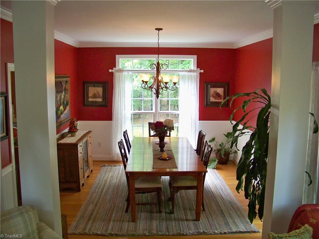 5805 Autumn Gate Drive Oak Ridge, NC 27310 - Photo 8 of 30 Attractive dining room has plenty of room for long table and china cabinet.