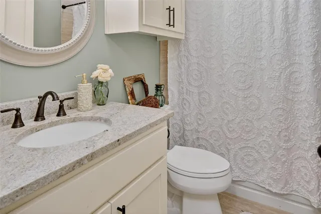 a view of a chair and table in backyard