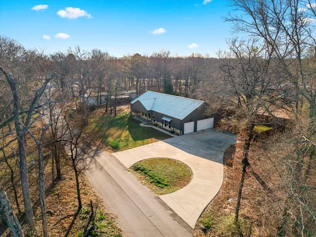 a view of a backyard with sitting area
