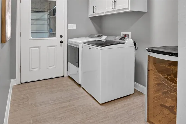 a view of house with yard and sitting area