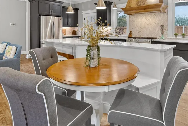 a kitchen with a sink stove and refrigerator