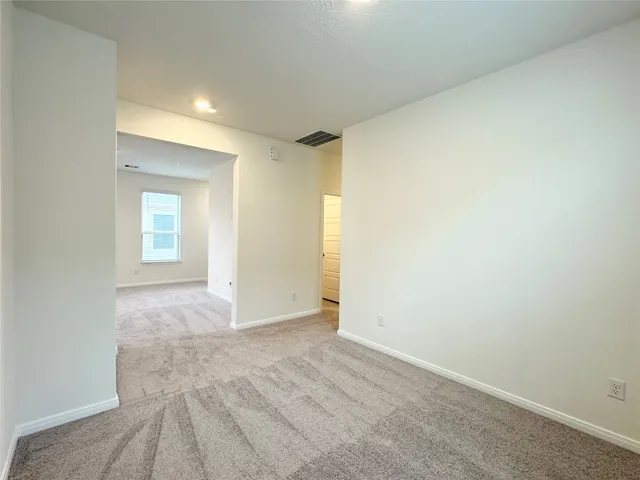 a view of an empty room and window