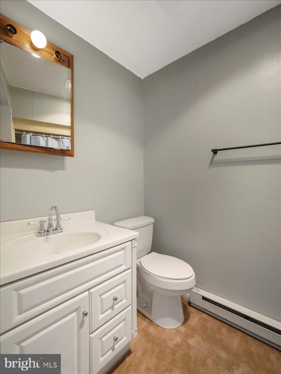 2731 Jack Road Chambersburg, PA 17202 - Photo 22 of 29 a bathroom with a sink a toilet and mirror