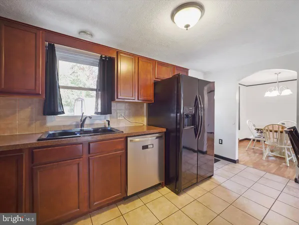a kitchen with stainless steel appliances granite countertop a refrigerator and sink