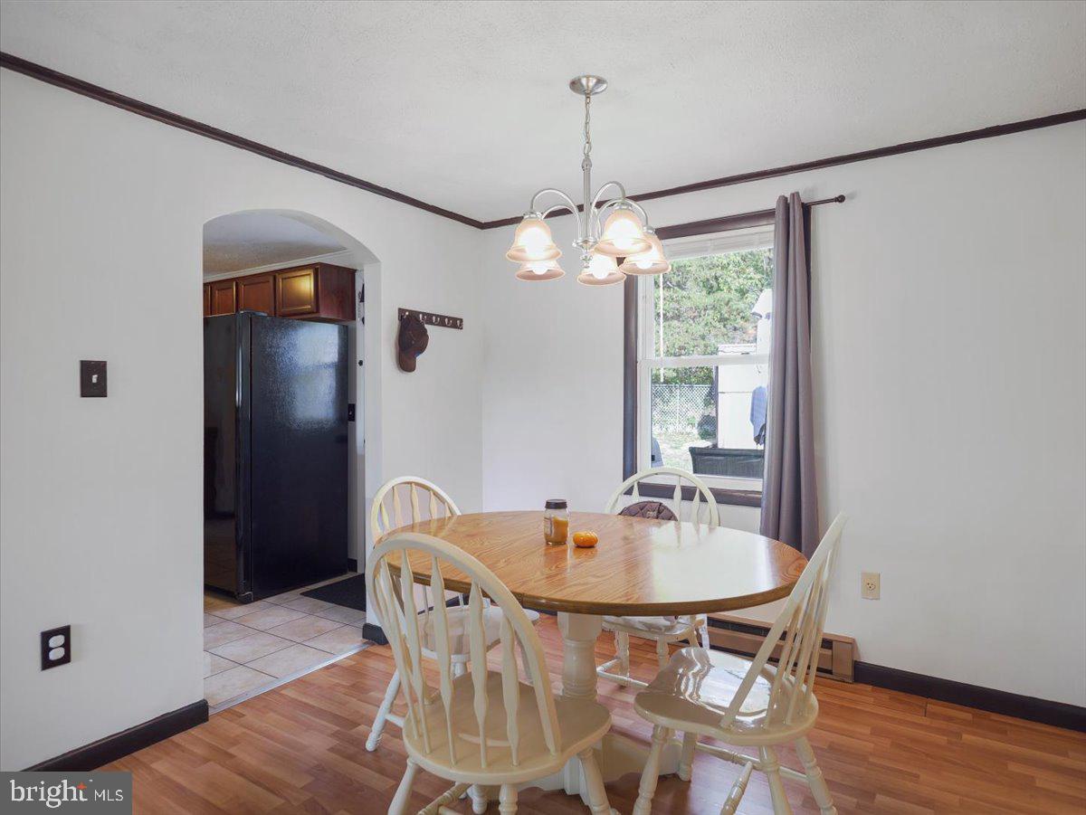2731 Jack Road Chambersburg, PA 17202 - Photo 10 of 29 a dining room with furniture and wooden floor