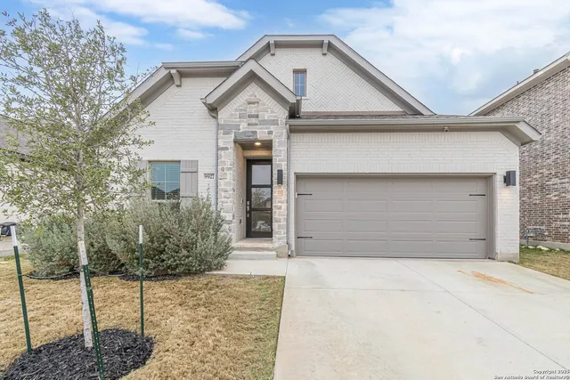 a front view of a house with a garage
