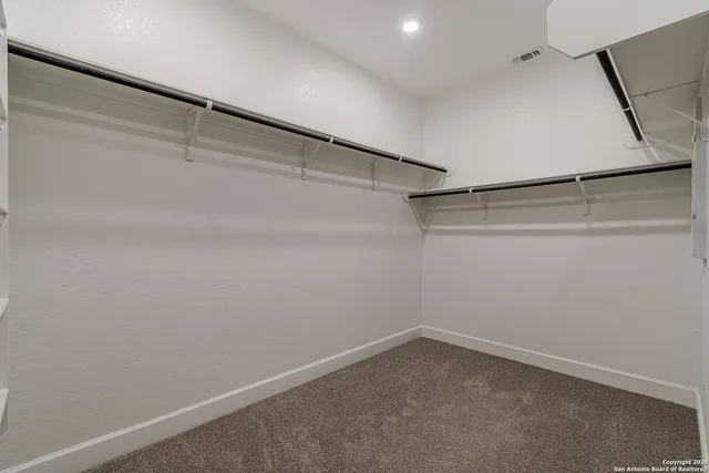 a view of an empty walk in closet