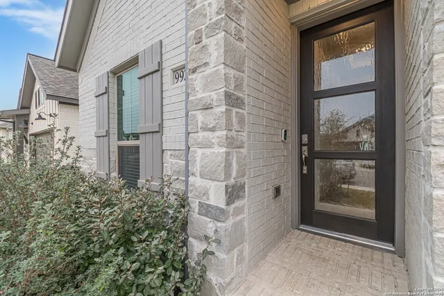 a view of a brick buildings balcony with a shower