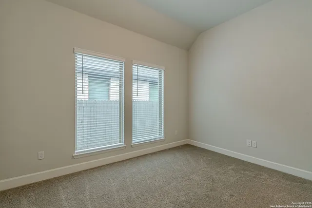 an empty room with closet area