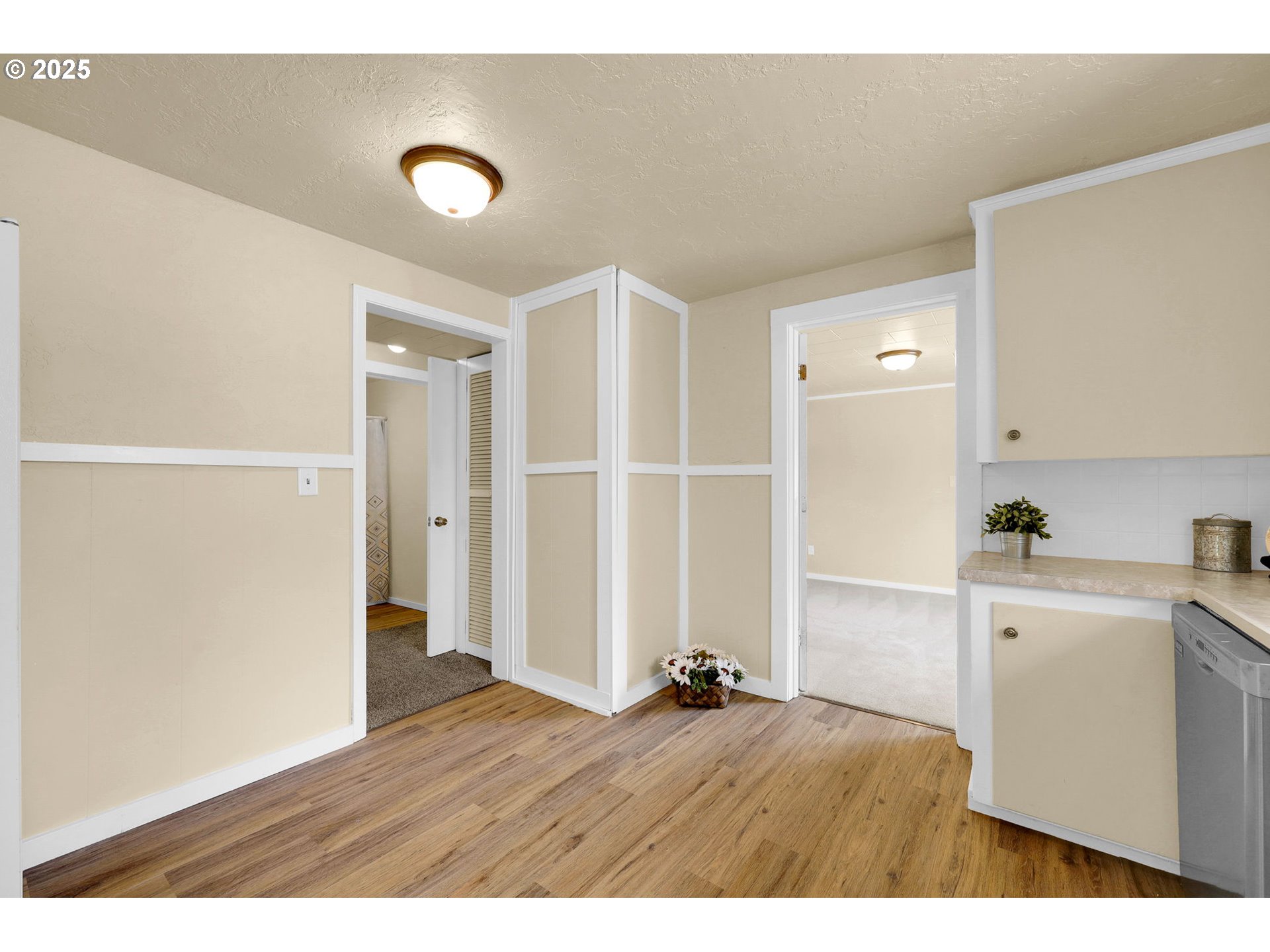 2785 Riverview Street Eugene, OR 97403 - Photo 11 of 44 a view of empty room with wooden floor and cabinet
