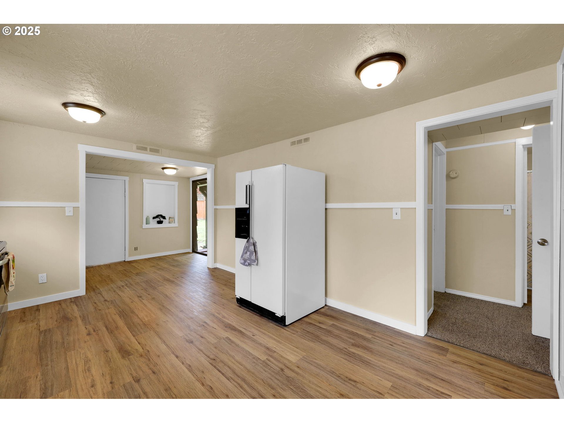 2785 Riverview Street Eugene, OR 97403 - Photo 13 of 44 a view of an empty room with wooden floor and closet