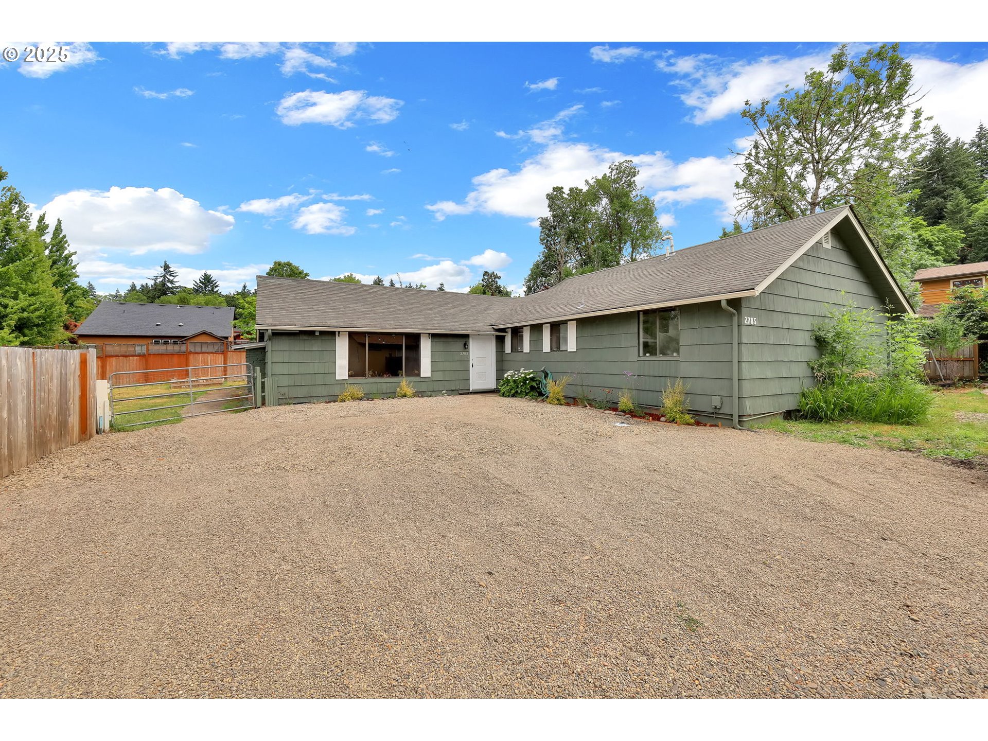 2785 Riverview Street Eugene, OR 97403 - Photo 2 of 44 a house view with a garden space