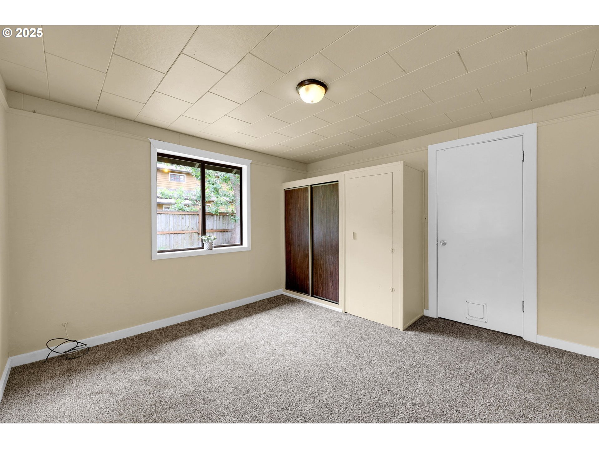 2785 Riverview Street Eugene, OR 97403 - Photo 22 of 44 a view of an empty room with windows