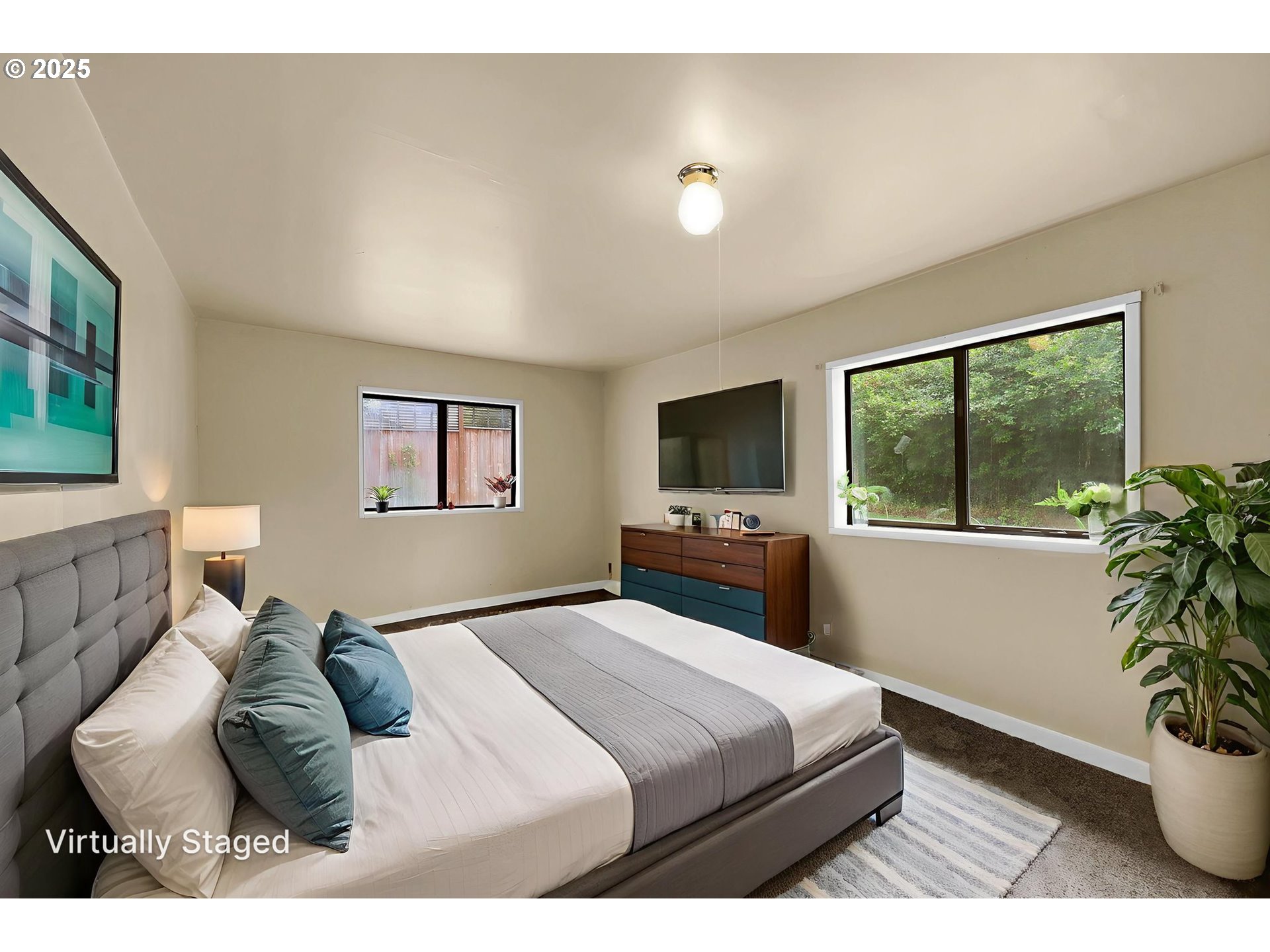 2785 Riverview Street Eugene, OR 97403 - Photo 41 of 44 a bedroom with a large bed and a flat screen tv