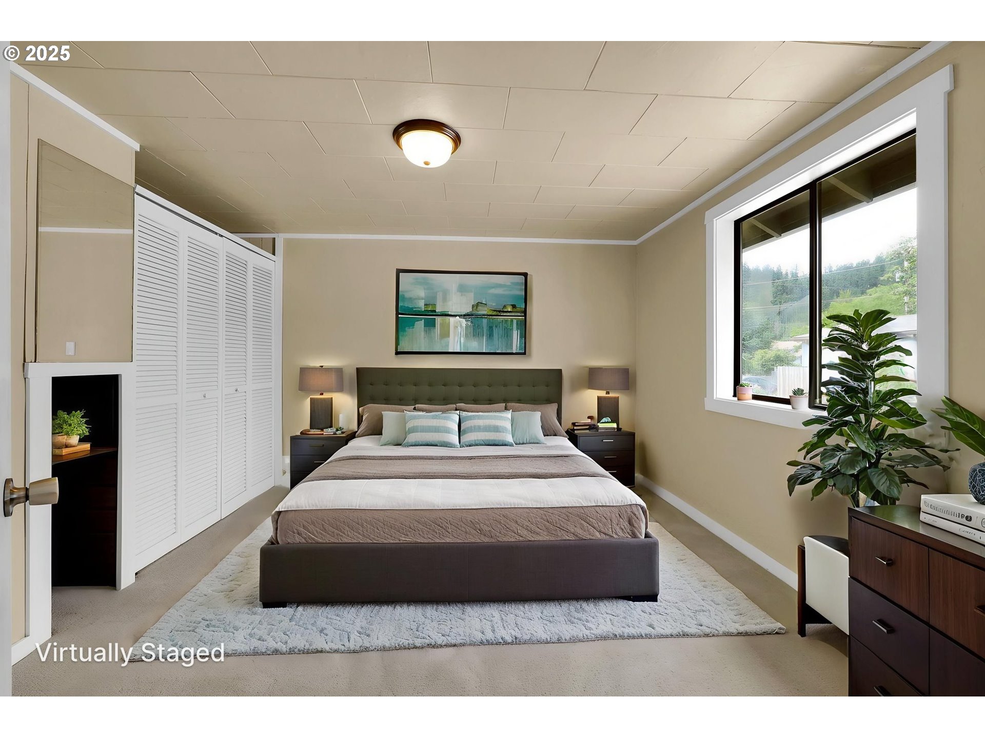 2785 Riverview Street Eugene, OR 97403 - Photo 42 of 44 a bedroom with a large bed and a potted plant