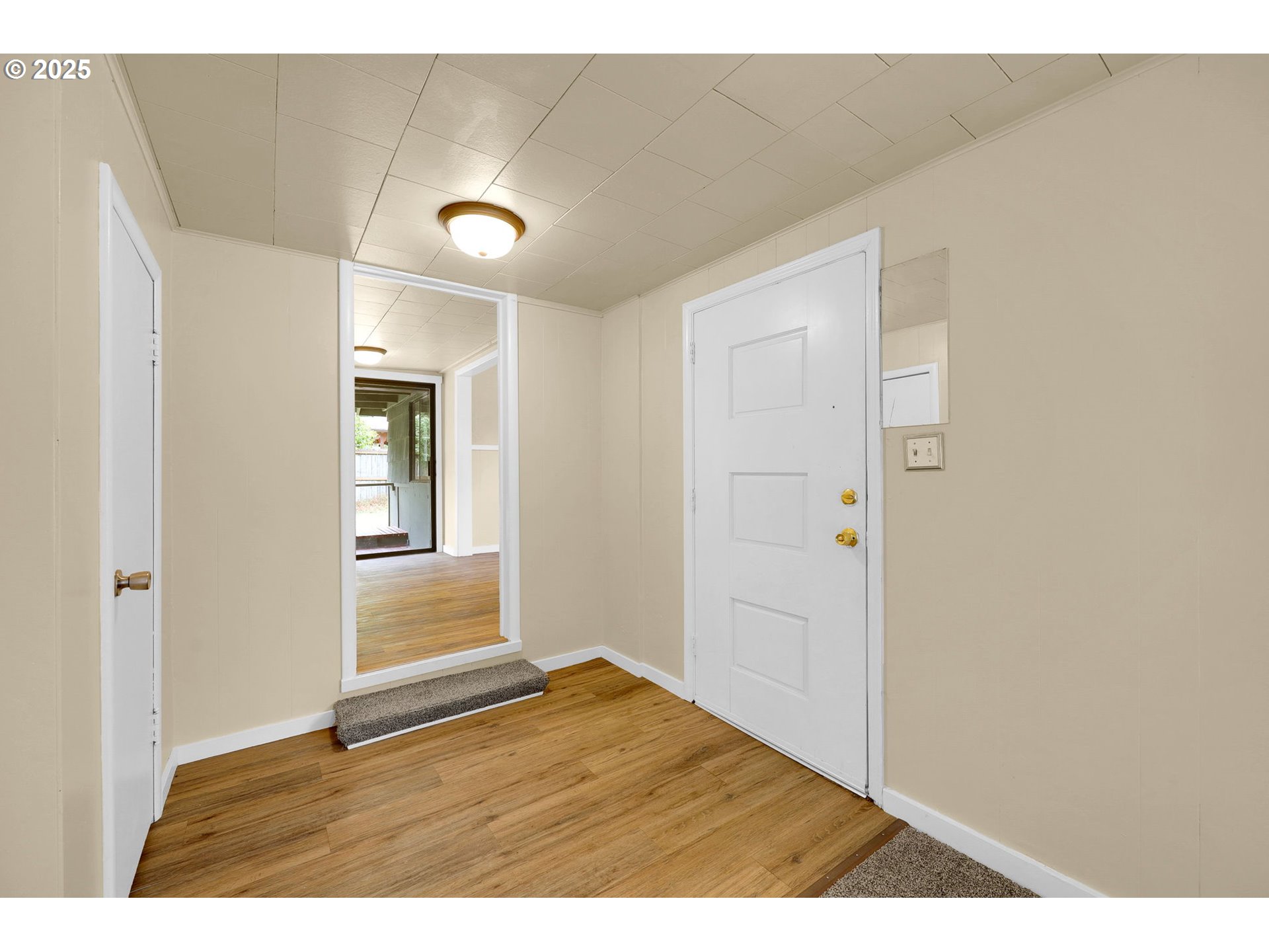 2785 Riverview Street Eugene, OR 97403 - Photo 7 of 44 a view of an empty room with window and wooden floor