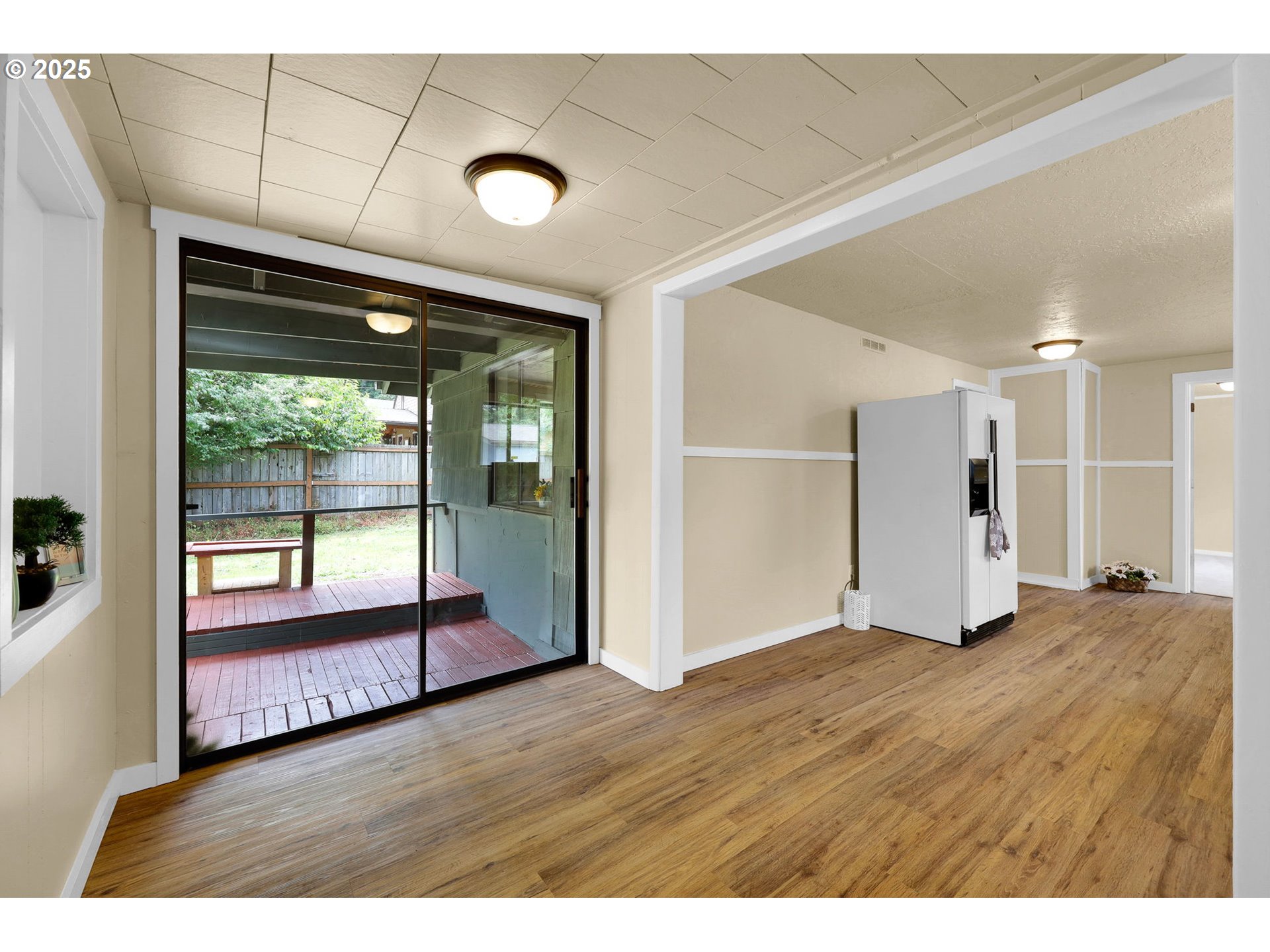 2785 Riverview Street Eugene, OR 97403 - Photo 8 of 44 a view of an empty room with wooden floor and a window