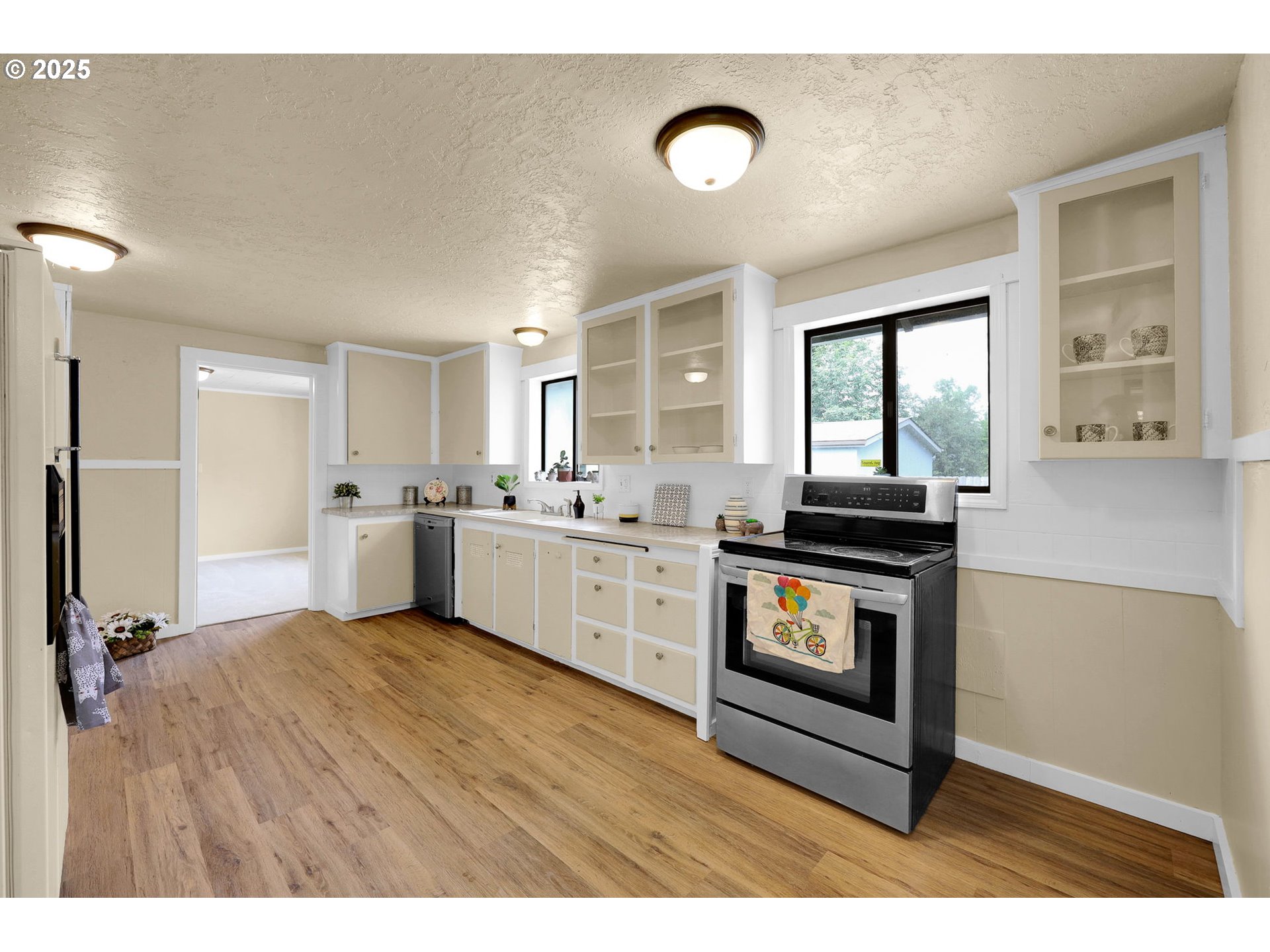2785 Riverview Street Eugene, OR 97403 - Photo 9 of 44 a kitchen with stainless steel appliances kitchen island wooden cabinets and granite counter tops