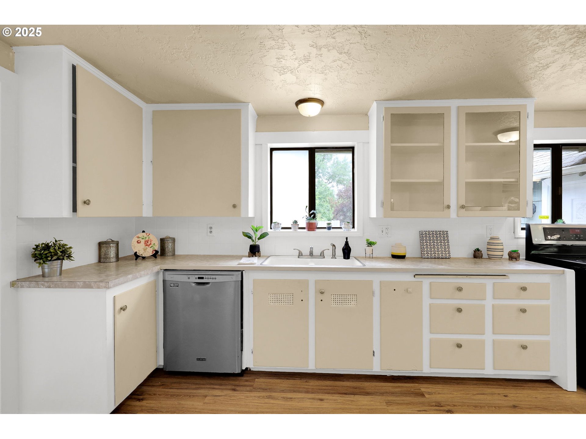 2785 Riverview Street Eugene, OR 97403 - Photo 10 of 44 a kitchen with a sink cabinets and window
