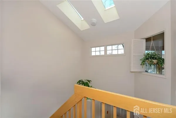 a view of staircase with windows