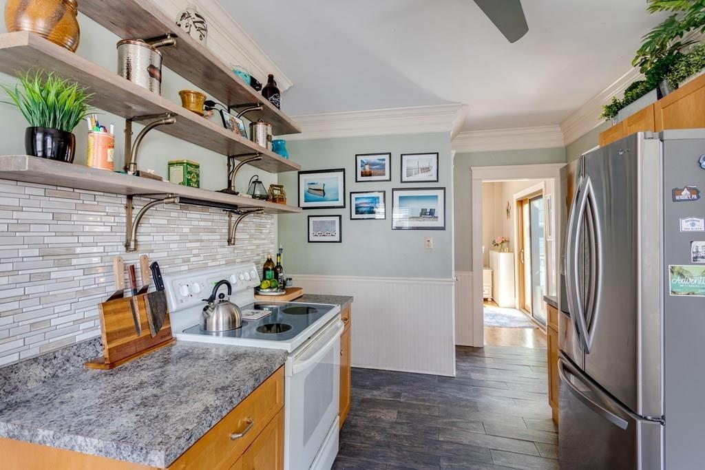 27 Hadwen Road Worcester, MA 01602 - Photo 12 of 27 a kitchen with stainless steel appliances granite countertop a refrigerator a stove and a sink