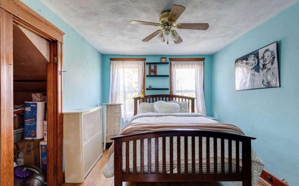 27 Hadwen Road Worcester, MA 01602 - Photo 14 of 27 a bedroom with a bed and a chandelier