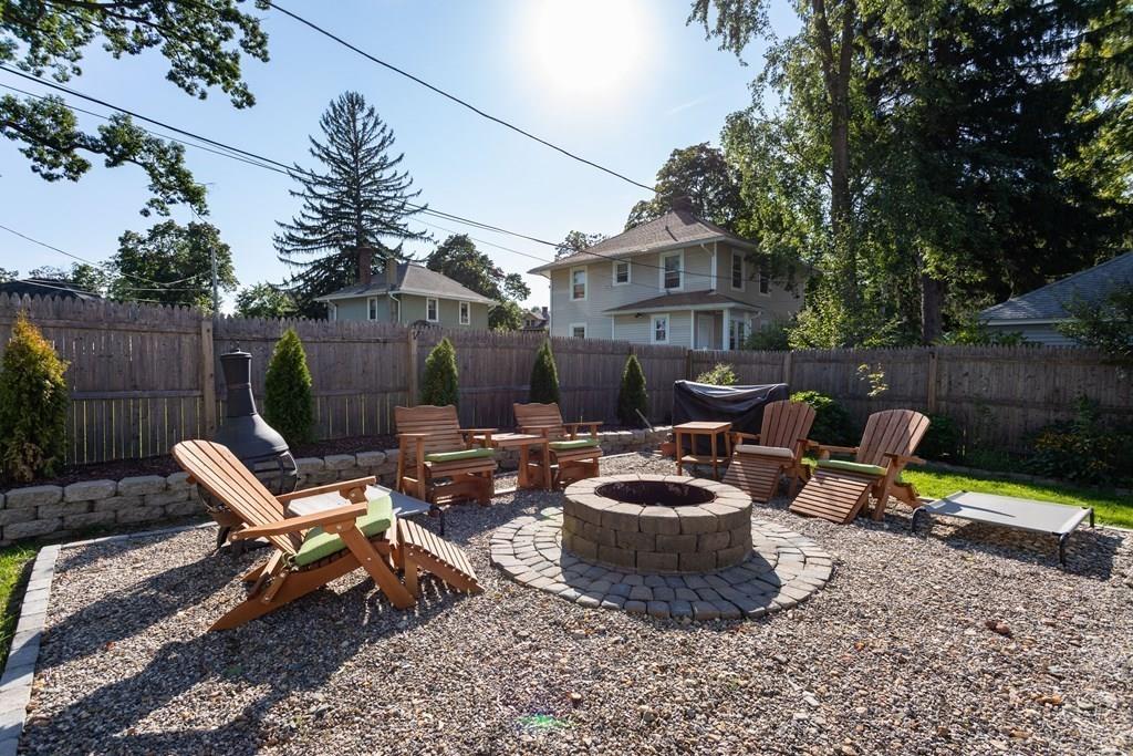 27 Hadwen Road Worcester, MA 01602 - Photo 25 of 27 a view of a patio with chairs and a fire pit