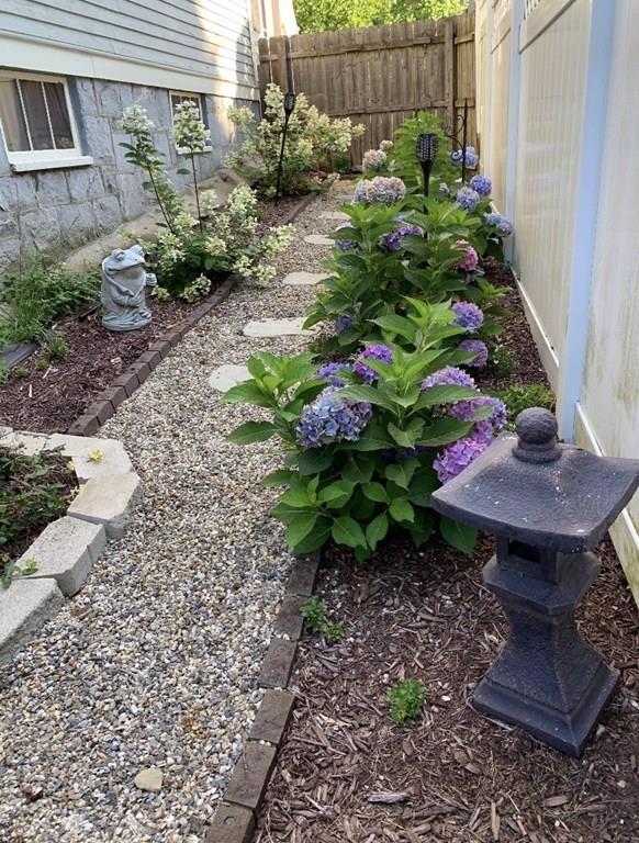 27 Hadwen Road Worcester, MA 01602 - Photo 26 of 27 a garden filled with flowers and flowers