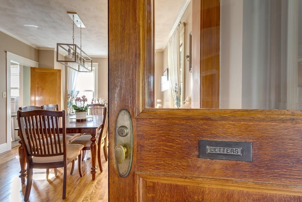 27 Hadwen Road Worcester, MA 01602 - Photo 4 of 27 a view of a hallway with furniture and floor to ceiling window