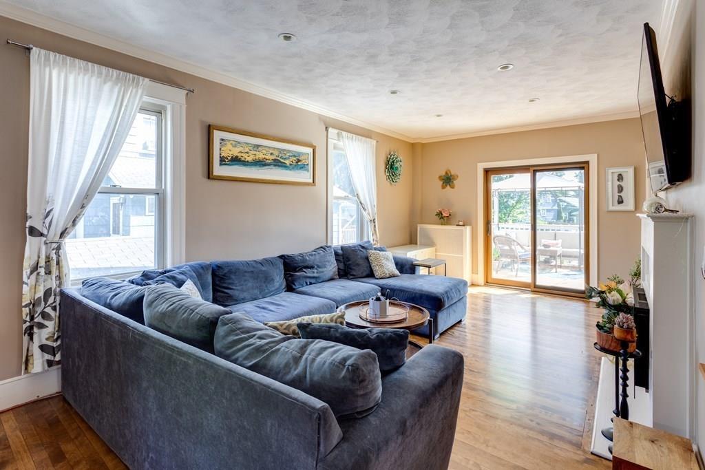 27 Hadwen Road Worcester, MA 01602 - Photo 7 of 27 a living room with furniture flat screen tv and a large window