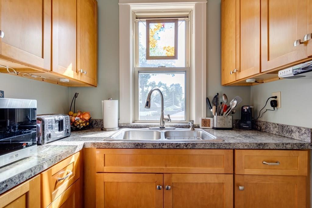 27 Hadwen Road Worcester, MA 01602 - Photo 10 of 27 a kitchen with sink cabinets and potted plant