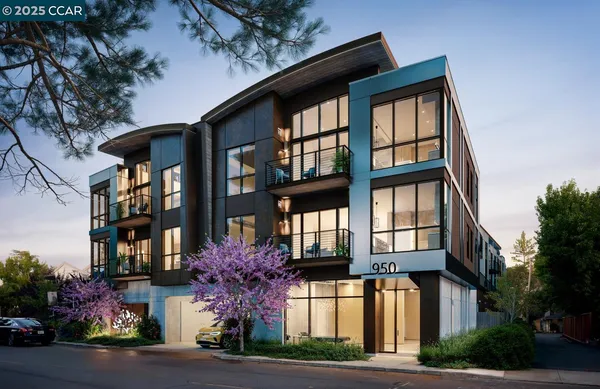 a front view of a multi story residential apartment building with yard and parking space