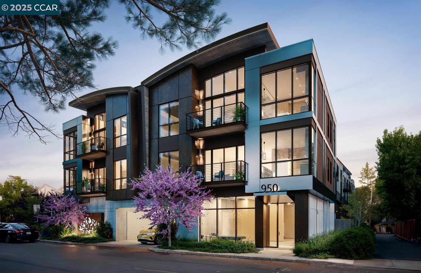 a front view of a multi story residential apartment building with yard and parking space