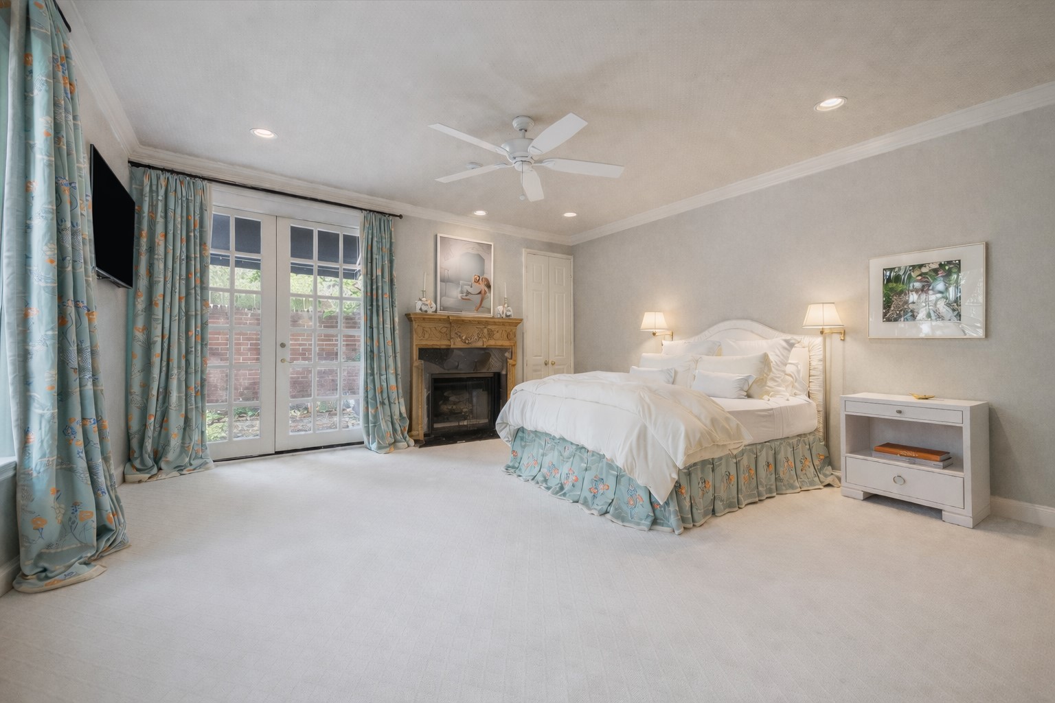 2902 West Lane, Unit A Houston, TX 77027 - Photo 14 of 23 a spacious bedroom with a large bed and a chandelier