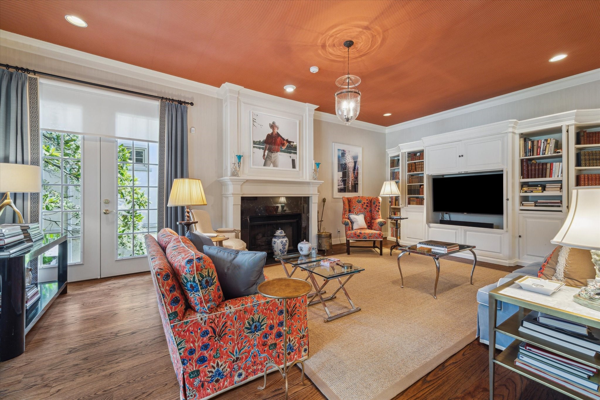 2902 West Lane, Unit A Houston, TX 77027 - Photo 2 of 23 a living room with furniture a flat screen tv and a fireplace